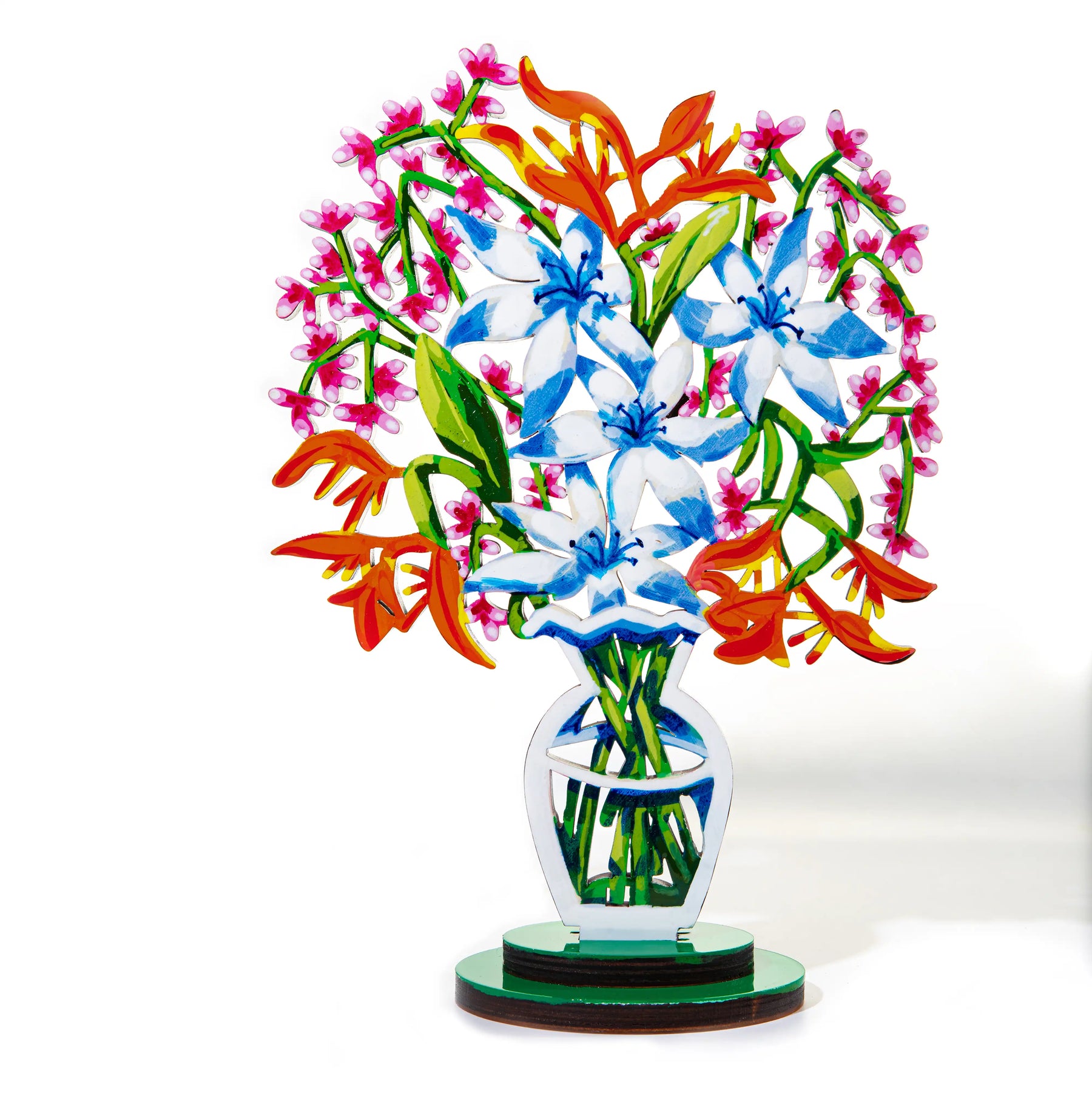 A a sculpture of a vibrant bouquet of blue and white flowers with orange and pink accents, displayed in a stylized, modern vase.