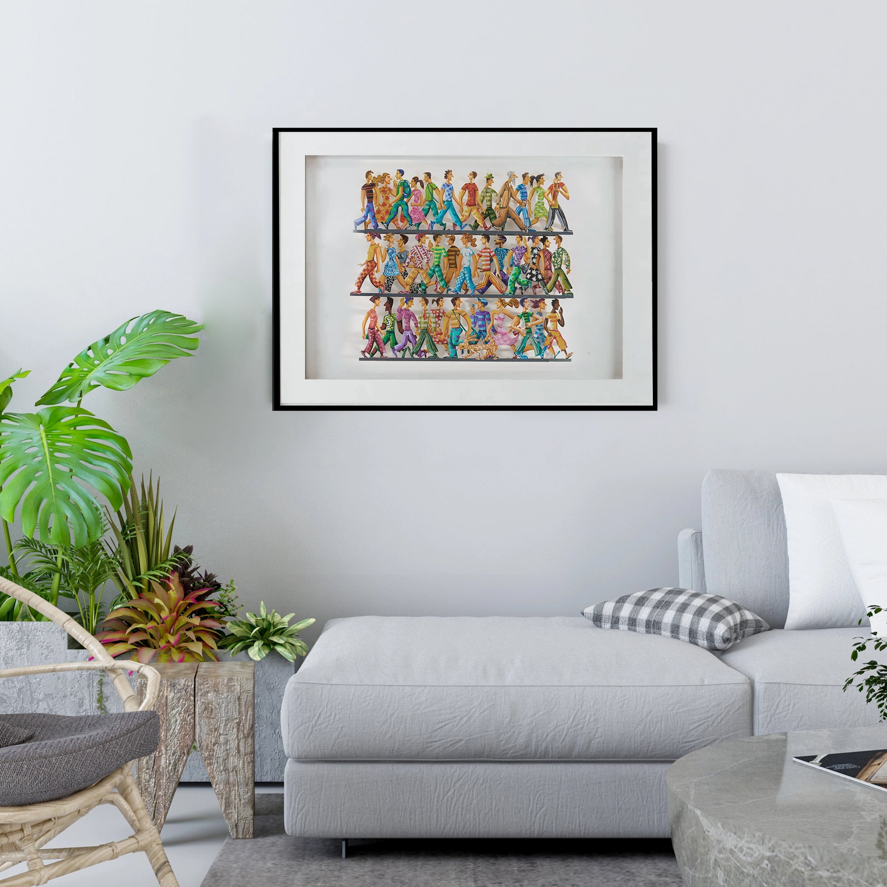 David Gerstein's '5th Avenue' papercut sculpture displayed on the wall of a modern living room, with a gray couch beneath it. The vibrant layers of the artwork add depth and energy to the space, creating a striking focal point.