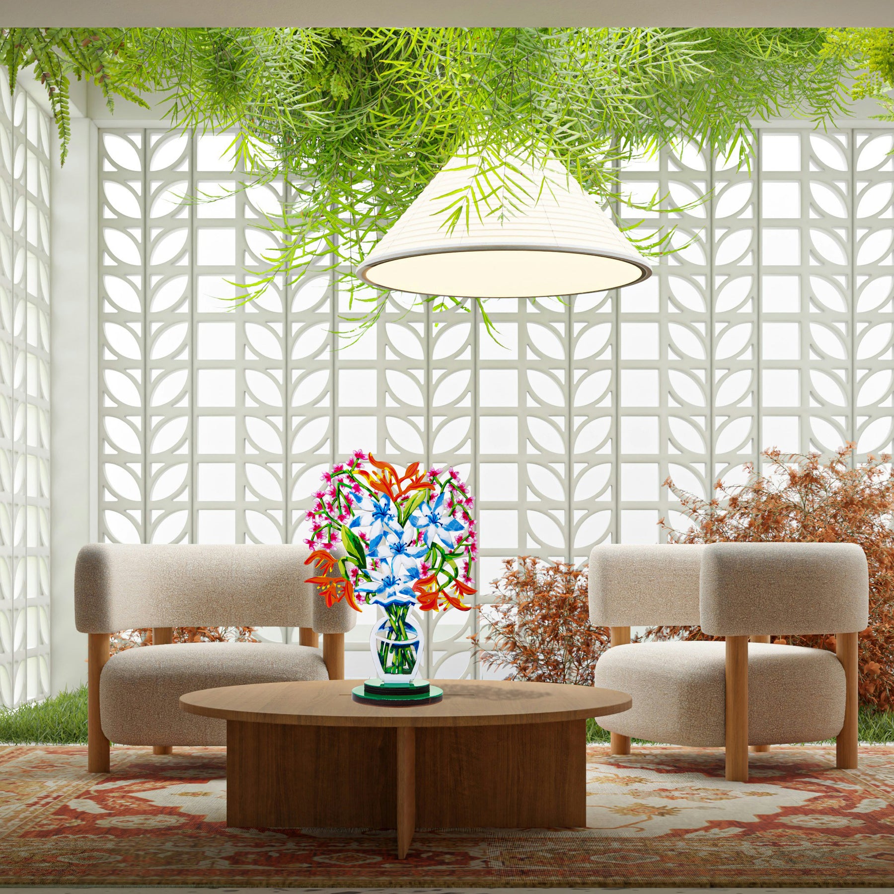 A a sculpture of a vibrant bouquet of blue and white flowers with orange and pink accents, displayed in a stylized, modern vase is seen placed on a table on a modern interior.