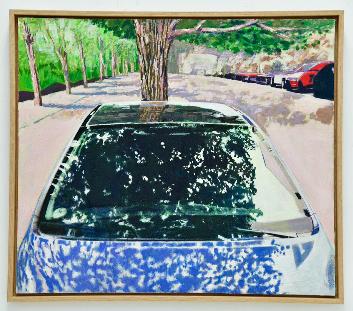 A painting of a blue car parked under a tree on a quiet street, with dappled sunlight and soft reflections of branches and sky flickering across the windshield.